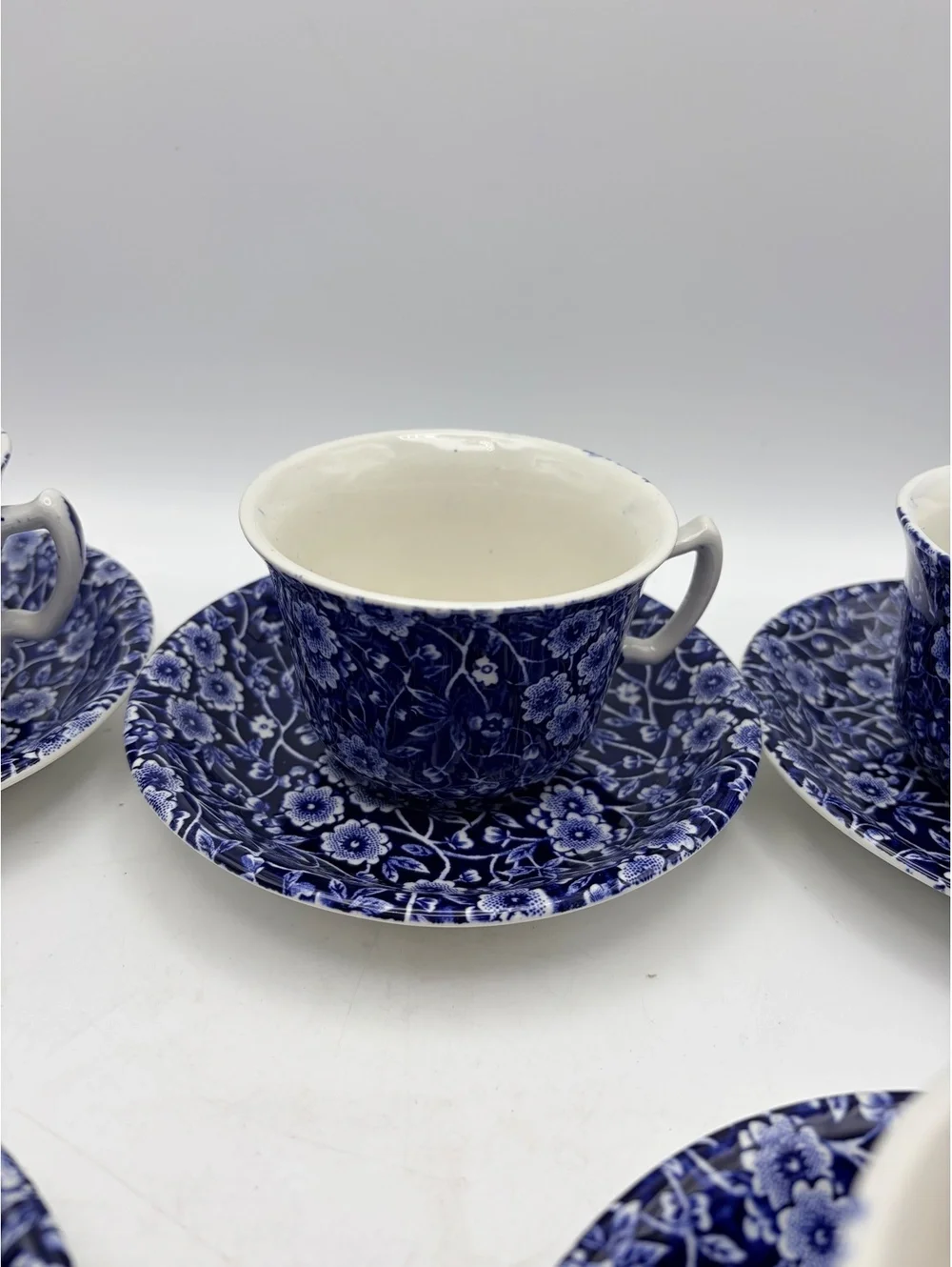 5 vintage sets of cups and saucers. Blue on white 1968 England.